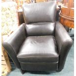 A black leatherette armchair, on ebonised legs.
