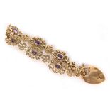 A 9ct gold fancy link bracelet, with heart shaped clasp, each section set with an oval amethyst, 20c