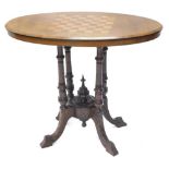 A Victorian walnut and marquetry loo table, the oval top with a moulded edge, on four turned support