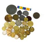 A small collection of coins and tokens, including Royal Artillery Canteen Woolwich, two Spade Guinea