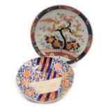A 20thC Imari charger, decorated with flowering shrub and prunus decoration and a bird, impressed se