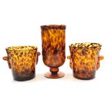 A Two's Company tortoiseshell glass vase, of cylindrical form on a circular base, 27cm high, togethe