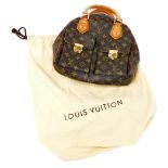 A Louis Vuitton monogram canvas Manhattan PM bag, the front with two compartments with brass monogra