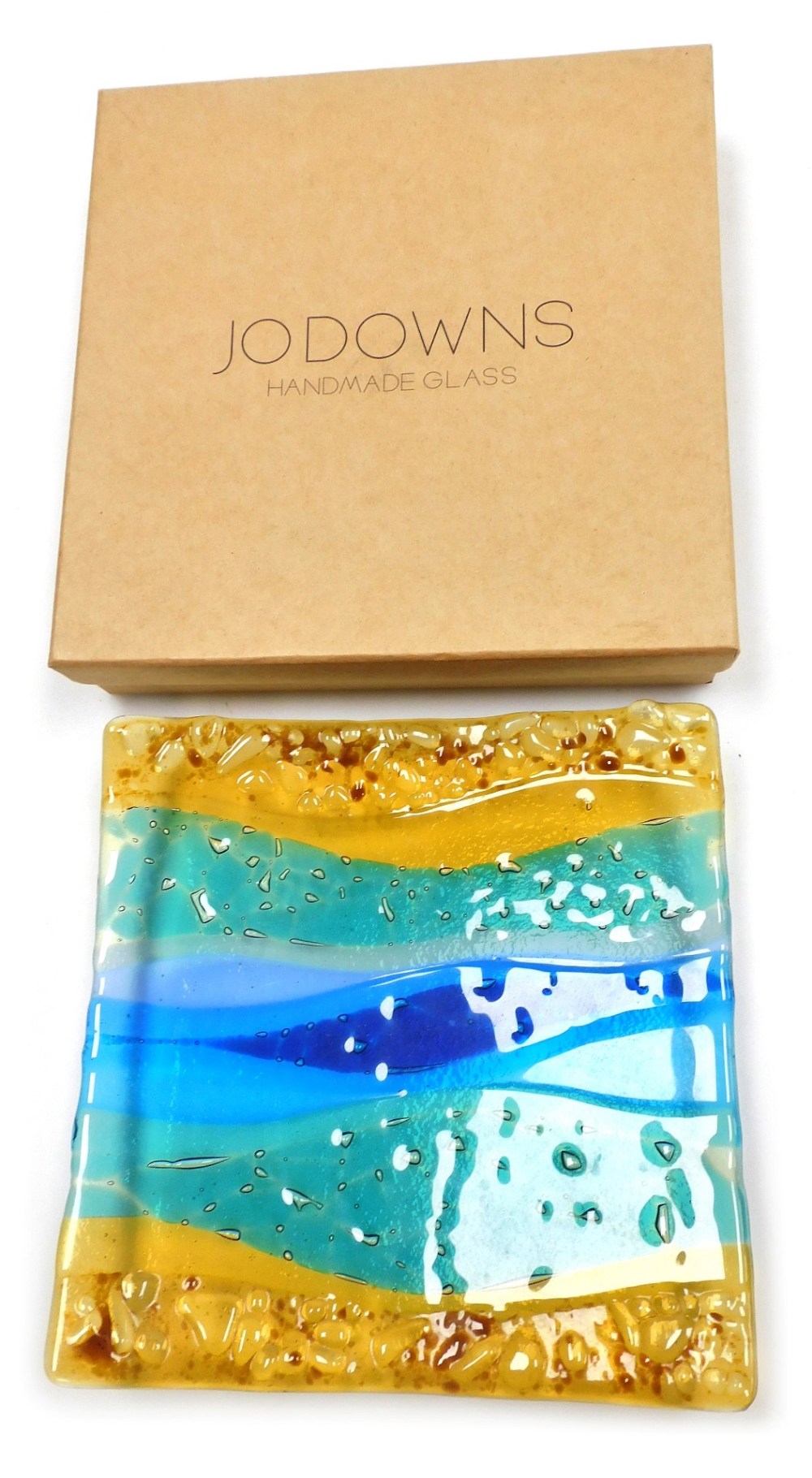 A Jo Downs hand made glass dish, of square form, decorated with flashes of amber, green, and blue gl