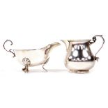 An Edward VII silver cream jug, with a scroll handle, London 1910, together with a George VI silver