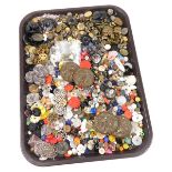 A collection of early 20thC and later buttons, varying designs and sizes, to include a set of four E