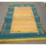 A Caucasian yellow and blue ground rug, decorated with stylised figures, animals, etc., 276cm x 201c