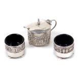 A 20thC Indian silver three piece cruet, comprising lidded mustard pot and two open salts, each piec