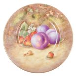 A Royal Worcester porcelain plate, circa 1954, painted with plums, strawberries and a cob nut, signe