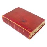 A Victorian scrap album, red cloth bound, dedicated internally to Minnie Blyth, from her grandpa wit