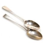 Two Georgian silver Old English pattern serving spoons, initial engraved, hallmarks rubbed, unmatche
