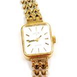 A Rotary 9ct gold lady's wristwatch, rectangular silvered dial, gold batons, quartz movement, on a g