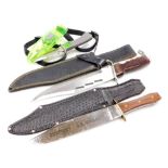 A group of three knives, comprising an outlaw knife, OK Corral commemorative knife, and a diving kni