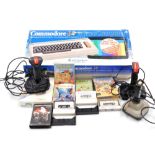 A Commodore 64 computer, boxed, together with various games, Pac Land, Panic, joysticks, etc. (a qua
