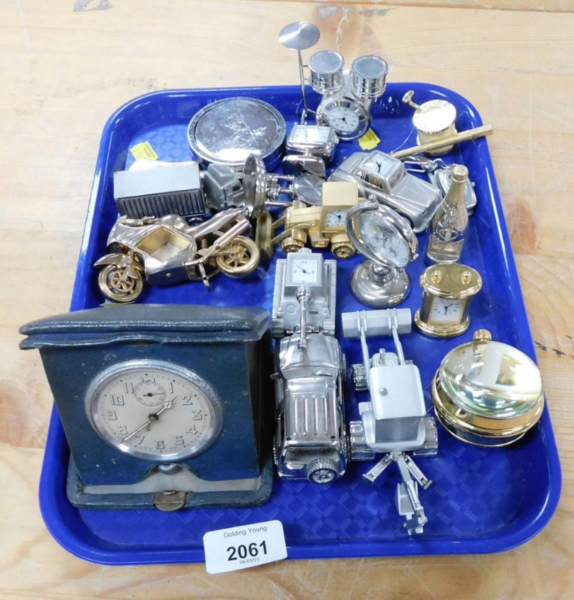 A group of novelty miniature clocks, in the form of a drum kit, tank, tractor, etc. (1 tray)