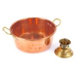 A 19thC brass and copper jam pan, with brass handles, 32cm diameter, and a 19thC brass candlestick,