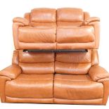 A tan leather sofa suite, comprising three seater and two seater sofa, each with manual recliners, t