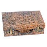 An early 20thC faux crocodile skin tan leather suitcase, 14cm high, 40cm wide, 25cm deep.