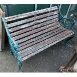 A 20thC cast iron garden bench, with green painted metal ends and wooden slat supports, 78cm high, 1