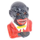 A reproduction money box, formed as a gentleman in red jacket, 16cm high.