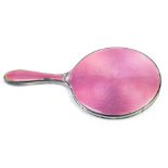 A George V silver and enamel hand held mirror, with pink guilloche enamel, Birmingham hallmarks rubb