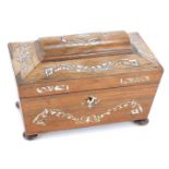 A Regency rosewood and mother of pearl inlaid tea caddy, of sarcophagus form, opening to reveal two