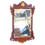 A Georgian mahogany fret framed wall mirror, with shell gilt moulded top, inset bevelled glass, 67cm