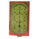 An early 20thC tin plate pocket Pin Ball game, 16cm high.