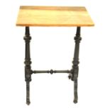 A Victorian ebonised occasional table, with a pine top, raised on fluted and turned columns over cab