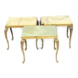 A 1970s set of three brass and green onyx occasional tables, raised on cabriole legs, each 36cm high