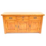 A mango wood sideboard, two central drawers over a coloured door, flanked by two further drawers ove
