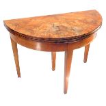 An early 20thC demi lune flame mahogany fold over tea table, raised on tapering square legs, 73cm hi