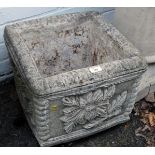 A reconstituted stone square garden planter, with fluted and floral decoration, 34cm high, the top 4