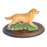 A Border Fine Arts figure of a Golden Retriever, on a turned oak base, stamped BFA Scotland 1982, 17