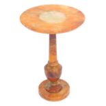 An Italian onyx side table, with a circular top, on a baluster column support with circular base, 52