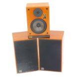 Three Ram speakers, model CD-10, each in a teak case, one lacking cover, 41cm and 33cm high. (3)