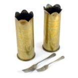 A pair of World War I brass shell cases, each with a fluted top bearing inscription Souvenir of The