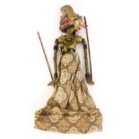 A Balinese carved wooden puppet, of a lady in flowing dress, with gilt material, 50cm high. (AF)