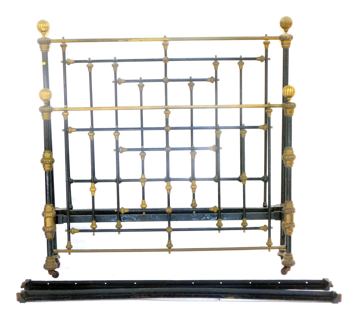 A Victorian metal framed double bed, with black and brass bulbous fittings, and a slatted base with