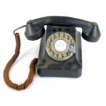 A Steepletone black plastic cased vintage style dial telephone.