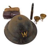 A WWII metal Air Warden's helmet, 26cm diameter, a military bandage and case, two converted shell ca