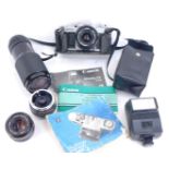A Canon SLR camera, Canon Tokina lens, instruction book, etc. (a quantity)