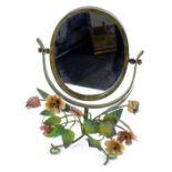 An early 20thC brass and wrought iron dressing table mirror, with oval swing mirror, on a shaped met