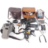 A group of camera equipment, comprising Samsung, Halina Super 8, Vivitar DVR 908M, Kodapak 126, Yash