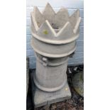 A Victorian chimney pot, with turreted top, on a square base, 78cm high.