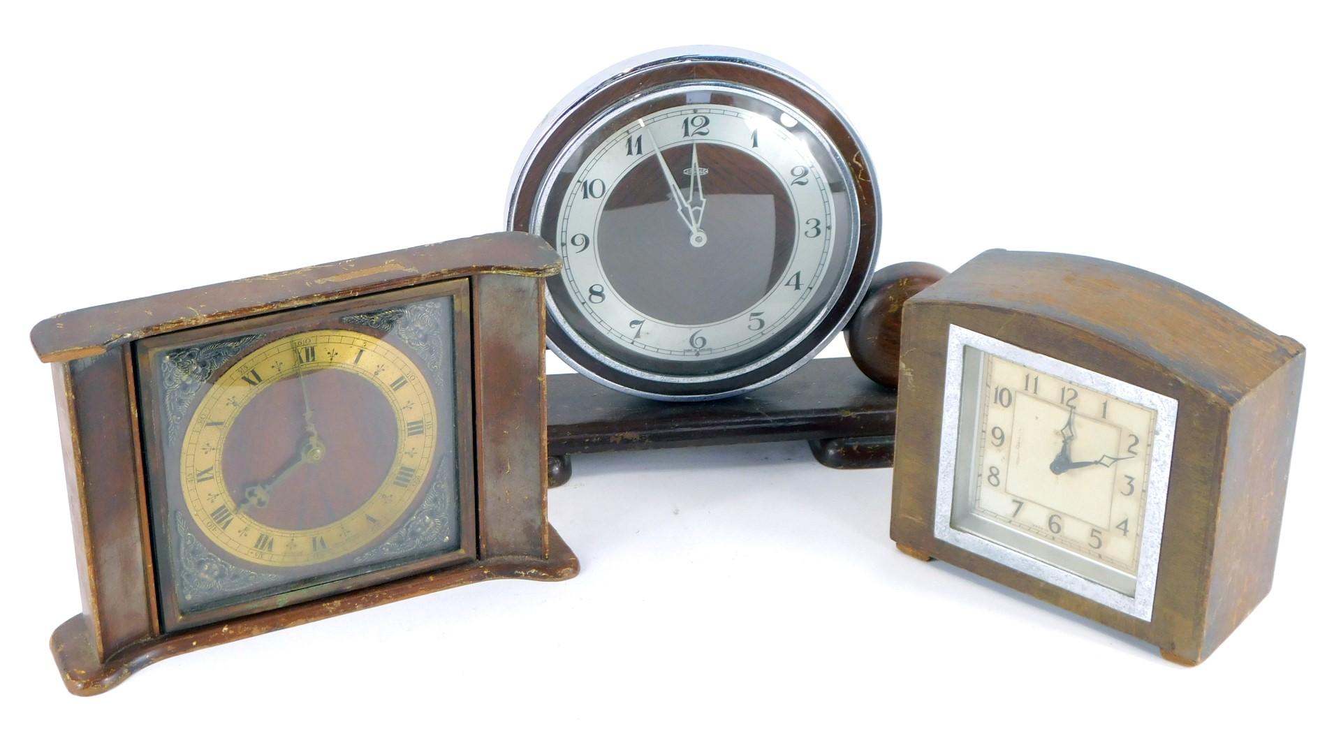 Three Art Deco mantel clocks, comprising an oak and silver rimmed numeric Metamec mantel clock, 21cm