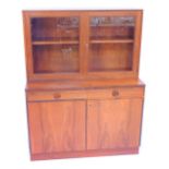 A Bodafors Swedish teak cupboard bookcase, the top with two glazed doors enclosing two shelves, abov