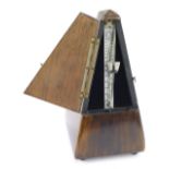 A Maelzel cased metronome, 23cm high.
