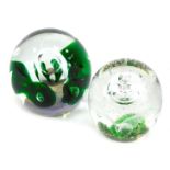 Two 20thC glass dump paperweights, comprising a green and purple bubble weight, 12cm high, and anoth