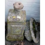 A reconstituted stone garden planter, with font bath, on a square set tapered base, 80cm high. (AF)